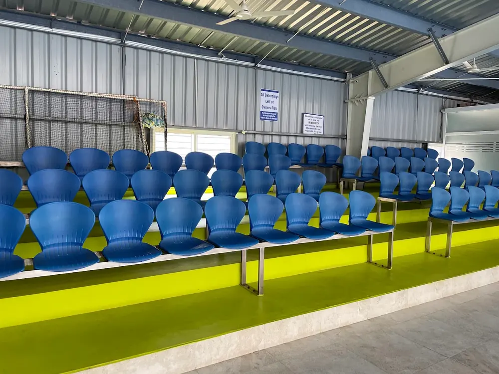 Tiered spectator seating beside the pool at Srujan Aquatic Center, Bangalore